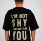 Not Shy Tee – Black Minimal Statement